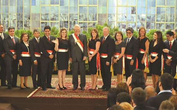Peruvian President Pedro Pablo Kuczynski (centre) poses with members of his Cabinet during a ceremony at the government palace in Lima.