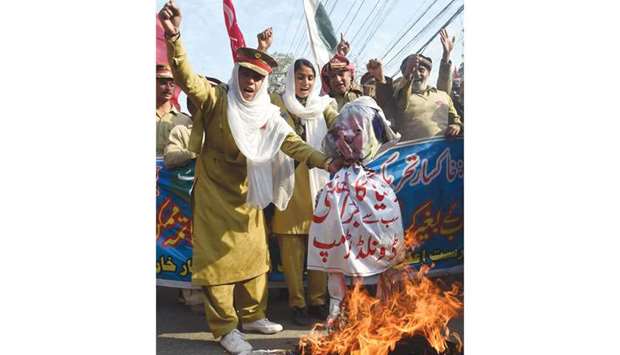 Demonstrators burn an effigy of US President Donald Trump during an anti-US protest in Lahore yesterday.