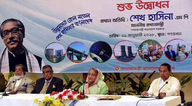 Prime Minister Sheikh Hasina launching the countrywide u2018Development Fairu2019 yesterday as Local Government and Co-operatives Minister Engineer Khandker Mosharraf Hossain, Information Minister Hasanul Haque Inu and Deputy Speaker of parliament Fazle Rabbi Mia look on.
