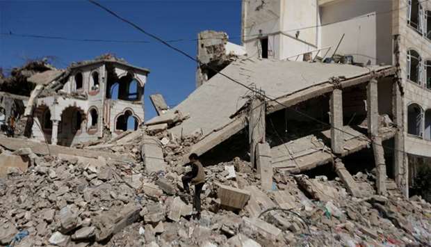 The wreckage of a building hit by air strikes in Sanaa