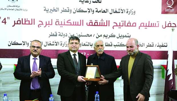 Qatar Charity officials and Palestinian authorities announce the completion of Al Dafer Tower reconstruction project in Gaza Strip.
