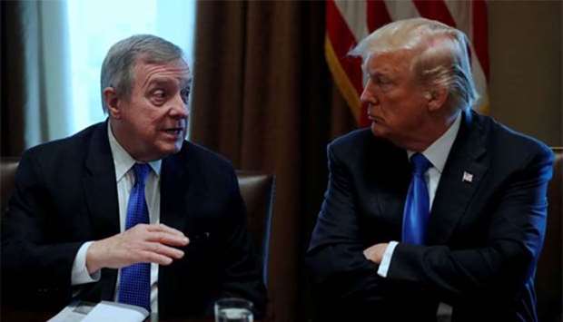 US President Donald Trump, flanked by Senator Dick Durbin, listens during a bipartisan meeting with legislators on immigration reform at the White House in Washington earlier this week.