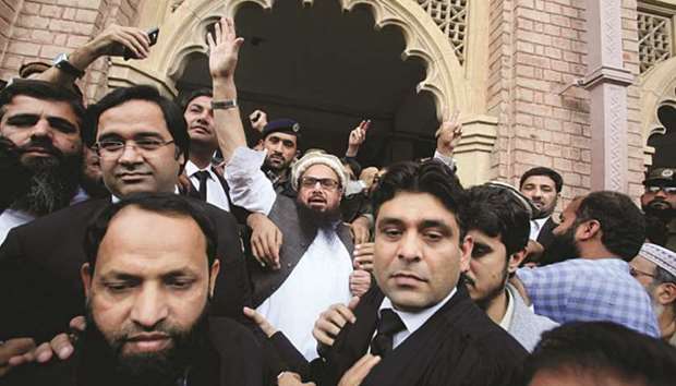 This picture taken on November 22 last year shows Hafiz Saeed acknowledging his supporters after the court in Lahore ordered his release from house arrest.