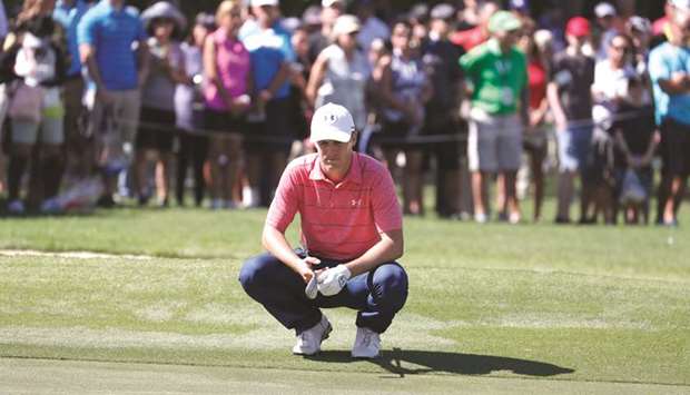 Jordan Spieth of the United States lines up a putt on the ninth hole during the first round of the Sony Open golf tournament at Waialae Country Club in Honolulu, Hawaii, on Thursday. (USA TODAY Sports)