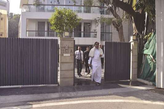 Chidambaram comes out of his house to speak to reporters in New Delhi yesterday.