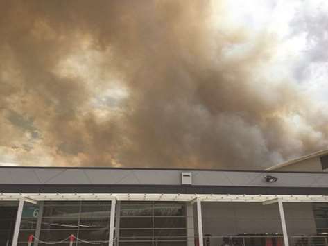 Smoke spreads during a bushfire at Newcastle Airport, New South Wales, yesterday, in this still image obtained from social media.