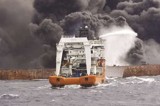 A rescue ship works to extinguish the fire on the burning Iranian oil tanker Sanchi in the East China Sea, in this picture provided by Shanghai Maritime Search and Rescue Centre and released by China Daily.