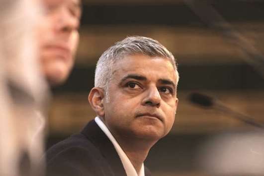 Mayor Khan pauses during his speech during an interruption by demonstrators at the Fabian Society New Year Conference.