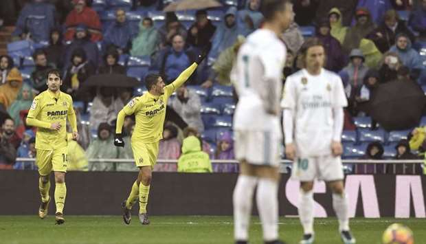 Villarrealu2019s Spanish midfielder Pablo Fornals (second from left) celebrates after scoring a goal during the La Liga match against Real Madrid at the Santiago Bernabeu Stadium in Madrid yesterday. (AFP)