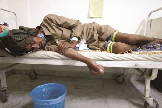 An old man infected with cholera lying on the bed at a hospital in Sanaa, Yemen.