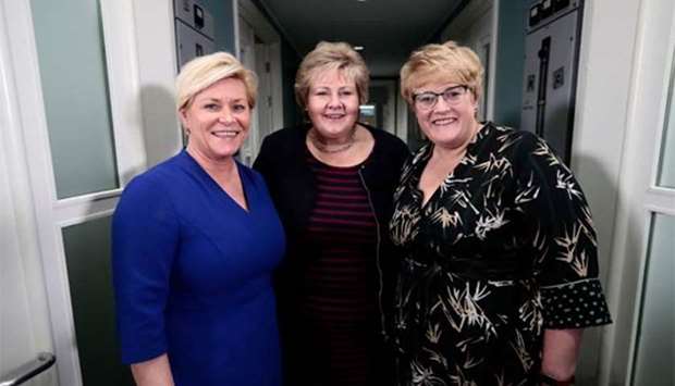 Prime Minister of Norway, Erna Solberg (centre), Minister of Finance Siv Jensen (left) and Trine Skei Grande, leader of the Liberal Party of Norway, pose for a photo at Moss, Norway, on Sunday.