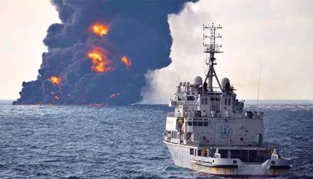 Smoke and flames coming from the burning oil tanker ,Sanchi, at sea off the coast of eastern China.