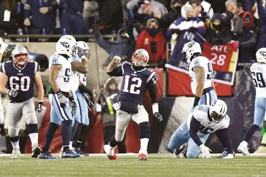 New England Patriots quarterback Tom Brady (No 12) celebrates throwing a touchdown pass against the Tennessee Titans during the third quarter of the AFC Divisional playoff game at Gillette Stadium. PICTURE: USA TODAY Sports