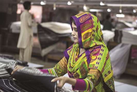 A worker carries out quality control checks at a textile manufacturer in Karachi (file). Exports of garments and hosiery witnessed a growth of 90.9% to u20ac2.05bn in January-September 2017 on a year-on-year basis, according to EU official data.