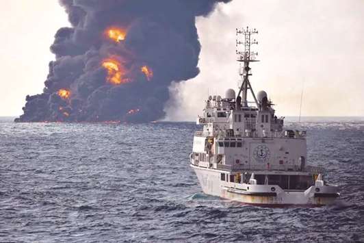 Smoke and flames coming from the burning oil tanker Sanchi at sea off the coast of eastern China.