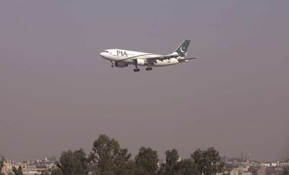 This file picture shows a Pakistan International Airlines (PIA) plane arriving at the Benazir Bhutto International Airport in Islamabad.