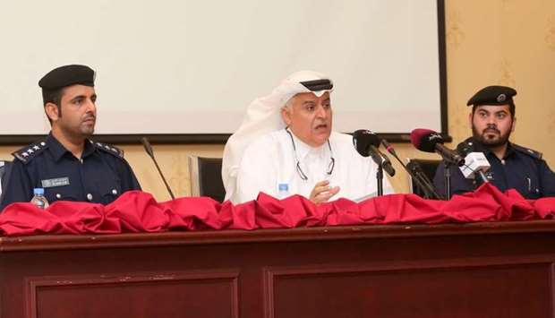 Brigadier Mohamed al-Malki (centre) announcing the achievements of the first 5-year Qatar Action Plan of the National Traffic Safety Strategy as other officials look on
