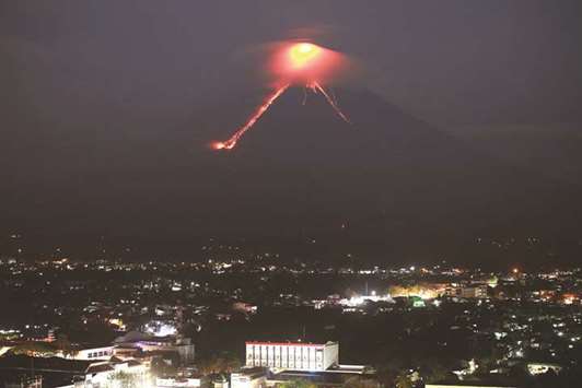 Lava from Mayon volcano is seen as it erupts in Legazpi, yesterday.