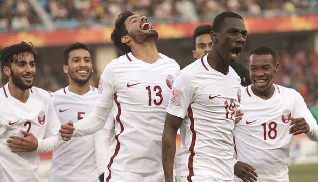 Almoez Ali (second from right) shows his joy after scoring the winner for Qatar yesterday.