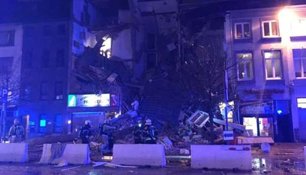 Emergency rescue personnel attend to the scene where a building has collapsed in Antwerp.