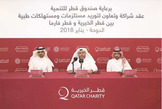 Officials of Qatar Charity, QFFD and Qatar Pharma at the agreement signing ceremony.