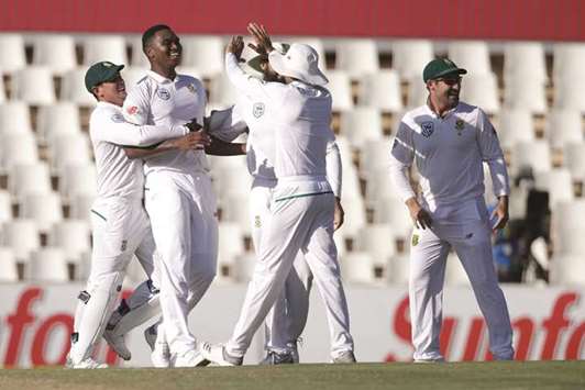 South African fast bowler Lungi Ngidi (second left) celebrates with teammates after dismissing Indian batsman and captain Virat Kohli during the fourth day of the second Test at Supersport cricket ground in Centurion yesterday. (AFP)