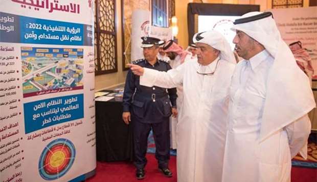 HE the Prime Minister and Interior Minister Sheikh Abdullah bin Nasser bin Khalifa al-Thani being briefed by NTSC secretary general Brigadier Mohamed Abdulla al-Malki at the launch of the Second Qatar Action Plan on Tuesday.