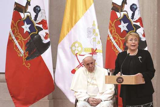 Chileu2019s President Michelle Bachelet speaks next to Pope Francis at the La Moneda Presidential Palace in Santiago, Chile, yesterday.
