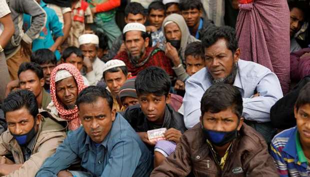Rohingya refugees wait for food supply distribution at Balukhali camp, near Cox's Bazar, Bangladesh