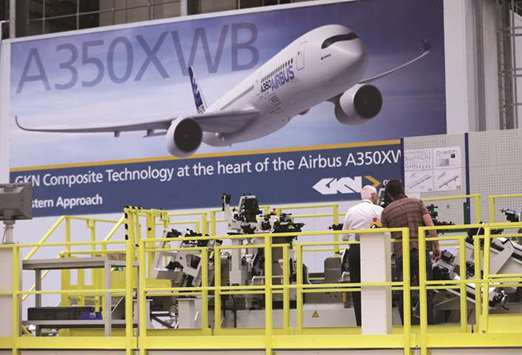 Employees inspect a jig used in the manufacturing of Airbus A350 at GKNu2019s aerospace factory in Filton, UK (file). The 430.1 pence-per-share Melrose bid was swiftly rejected by GKN yesterday on the grounds that the terms of the paper-and-cash offer are u201ceffectively unchangedu201d from a first approach made by Melrose in private on January 8.