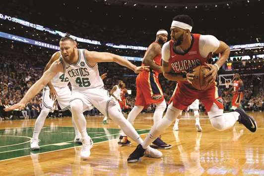 New Orleans Pelicans forward Anthony Davis (right) is guarded by Boston Celtics centre Aron Baynes (left) during the first half at TD Garden. PICTURE: USA TODAY Sports