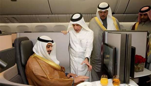 Akbar al-Baker shows Qatar Airways' new Business Class seat, Qsuite, to Sheikh Mohamed al-Abdullah al-Sabah at the Kuwait Aviation Show on Wednesday.