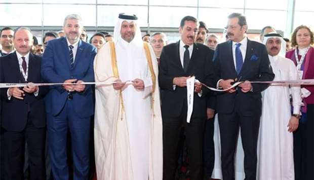 HE the Minister of Economy and Commerce Sheikh Ahmed bin Jassim bin Mohamed al-Thani leads the ribbon-cutting ceremony with Turkeyu2019s Minister of Customs and Trade Bulent Tufenkci. The two officials were also joined by Independent Industrialists and Businessmen Association (Musiad) president Abdurrahman Kaan, Union of Chambers and Commodity Exchanges of Turkey president Rifat Hisarciklioglu, Turkish ambassador Fikret Ozer, and other officials. PICTURE: Jayan Orma.