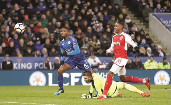 Leicester Cityu2019s Kelechi Iheanacho (left) scores against Fleetwood Town during the FA Cup Third Round Replay match in Leicester, Britain, on Tuesday night. (Reuters)