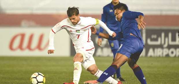Palestine captain Mahmoud Abuwarda (left) in action against Thailand during their group stage game on Tuesday.