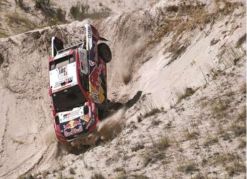 Toyota driver Nasser Saleh al-Attiyah of Qatar and his co-driver Matthieu Baumel of France finished fifth in the 11th stage of the Dakar Rally 2018 yesterday. (AFP)