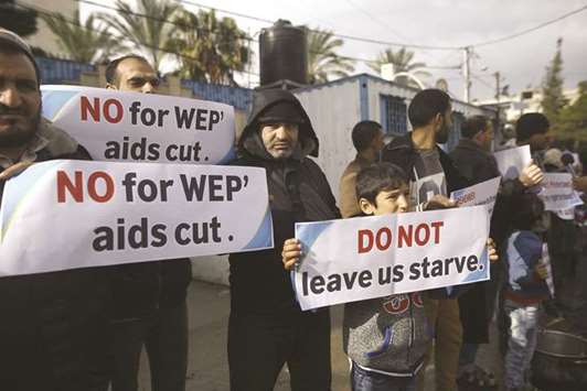 Palestinians take part in a protest against aid cuts outside of United Nationsu2019 offices in Gaza City, yesterday.