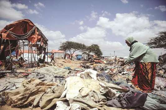 Somali refugees prepare to leave with their belongings after the landowner orders to leave all refugees at the Wedow refugee camp in Mogadishu yesterday.