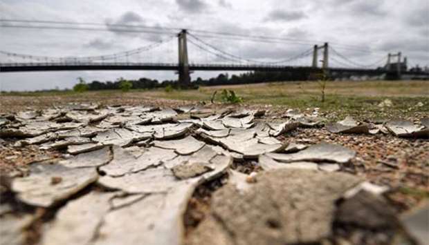 The dry river bed of the Loire is seen in Montjean-sur-Loire, western France. The last three years were the hottest on record, the United Nations weather agency said on Thursday.
