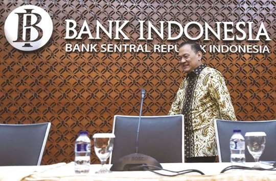 Bank Indonesia governor Agus Martowardojo arrives at a news conference at the banku2019s headquarters in Jakarta. BI said it would bring in faster plans to relax its reserve requirement for banks and would start similar averaging rules for foreign exchange deposits and Islamic banks.