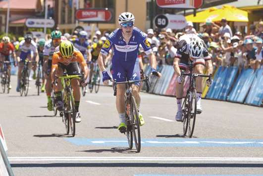 Quick Step Floors team rider Elia Viviani of Italy (centre) crosses the finish line to win the third stage of the Tour Down Under in Adelaide yesterday. (AFP)