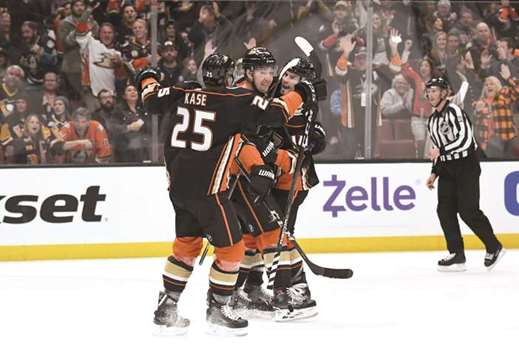 Anaheim Ducks centre Adam Henrique celebrates with right wing Ondrej Kase (left) and left wing Nick Ritchie (right) after scoring a goal against the Pittsburgh Penguins in the second period of their NHL game at the Honda Centre. PICTURE: USA TODAY Sports