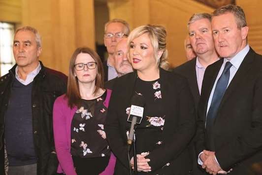 Sinn Feinu2019s Northern Ireland leader Michelle Ou2019Neill (centre), flanked by members of her party, speaks to members of the media at The Parliament Buildings, commonly known as Stormont, in Belfast yesterday.