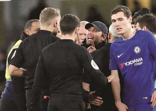Chelsea manager Antonio Conte argues with referee Graham Scott after his teamu2019s win over Norwich City in the FA Cup Third Round Replay on Wednesday. (Reuters)