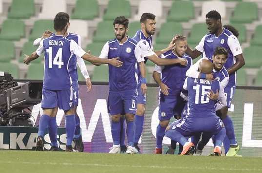 Al Khor players celebrate one of their goals against Al Ahli in the QNB Stars League yesterday.