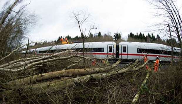 Firefighters removing trees which fell on an ICE highspeed train of German railway operator Deutsche Bahn. The picture was taken near Lamspringe, northern Germany.