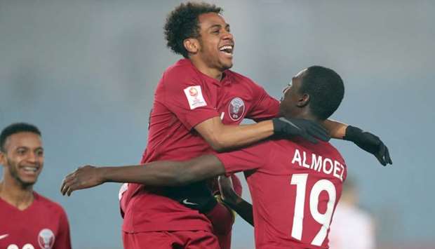 Qatar's Almoez Ali (right) and Hisham Ali celebrate during their team's quarter-final match against Palestine in the Asian U23 Championship in Changzhou, China, Friday. Almoez scored two goals and Hisham added a third as Qatar defeated Palestine 3-2 in a thrilling game to qualify for the semi-finals.