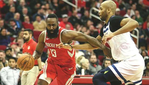 Houston Rockets guard James Harden (13) dribbles the ball as Minnesota Timberwolves forward Taj Gibson (67) defends during the second quarter of their NBA game on Thursday. PICTURE: Troy Taormina-USA TODAY Sports