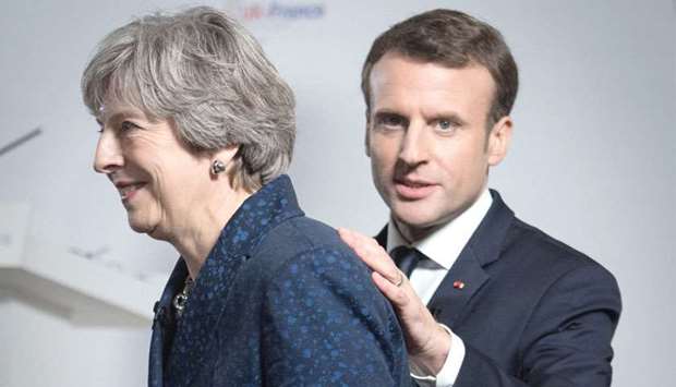 Prime Minister Theresa May and Franceu2019s President Emmanuel Macron attend a news conference at the Royal Military Academy in Sandhurst.