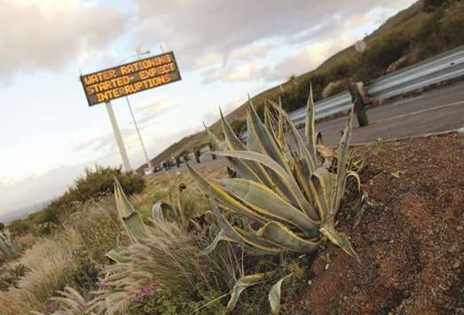 This picture taken on October 25 last year shows a sign warning Cape Town residents of water restrictions.